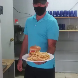 a man holding a plate of food