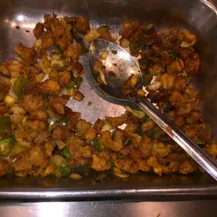 a serving dish with a spoon in it