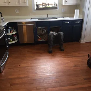 One of the installers working in the kitchen