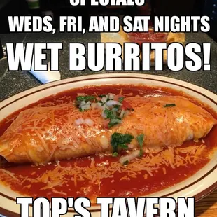 a plate of burritos on a table