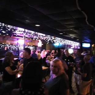 a large group of people sitting at tables