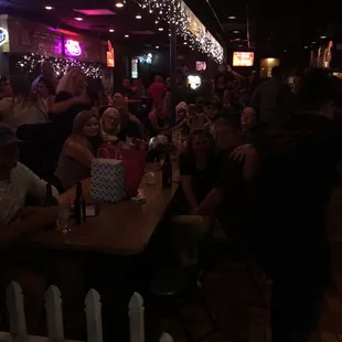 a large group of people sitting at tables