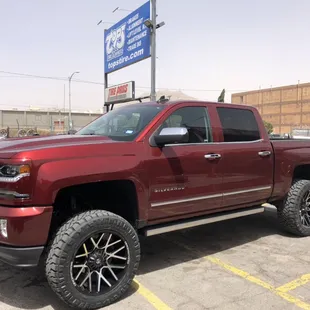 Lifted Silverado 1500 with new rims and tires