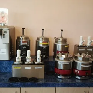lots of different syrups. The machine on the far left is for fresh whipped cream.