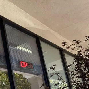 Here is the employee Just sitting by the window on her phone