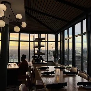 a dining room with a view of the city