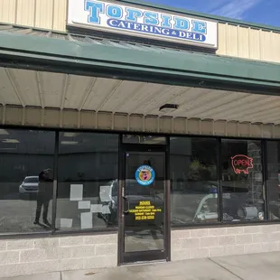 Outside, next to Dollar General