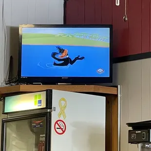 Looney Tunes on the TV in the corner