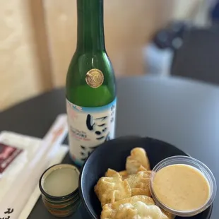 Pork &amp; chicken gyoza + Nigori unfiltered sake