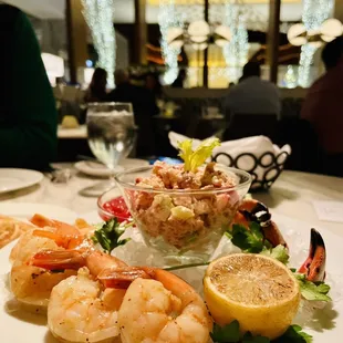 a plate of shrimp and salad