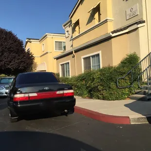 Car parked on the red curb, which people do all the time without anyone getting towed, and they leave their cars overnight parked like this.