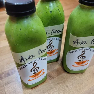 three bottles of green smoothie