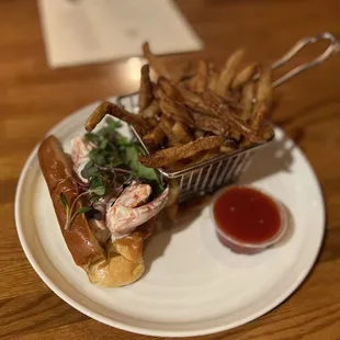 a plate of fries and a lobster sandwich