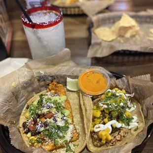 Mr.Orange taco (left), Brushfire tacos (right), and regular house margarita