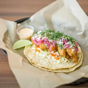 a fish taco on a tortilla