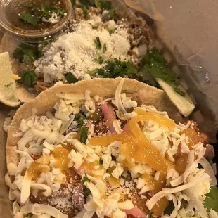 Green chili pork taco with tomatillo salsa and Baja shrimp taco.