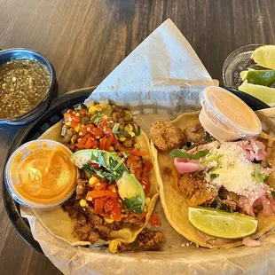 The MoFaux and Baja shrimp tacos with tomatillo salsa, Diablo sauce, &amp; chipotle sauce.