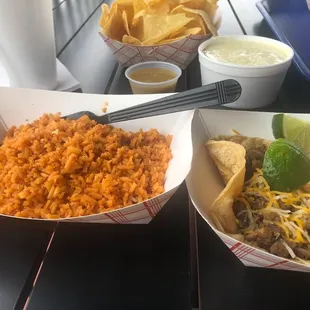 a bowl of rice and a bowl of salsa