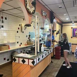a man and a woman in a restaurant