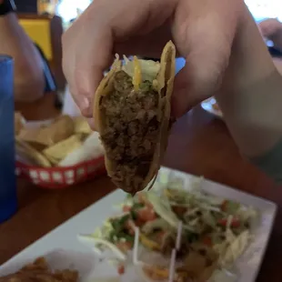 Look at all the beef stuffed into that hard taco! This place feeds you like family. All 7 dishes were amazing! Can&apos;t wait to go back.