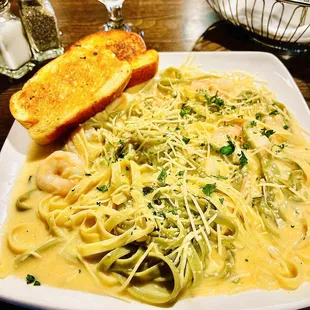a plate of pasta with shrimp