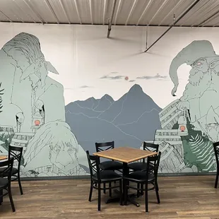 a mural of mountains and trees