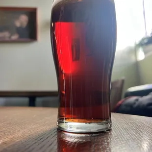 a pint of beer on a table