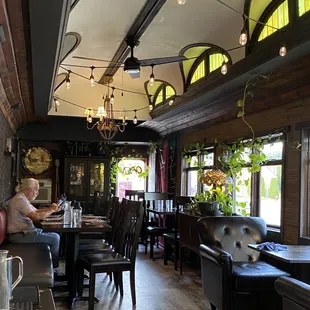 a man sitting at a table in a restaurant