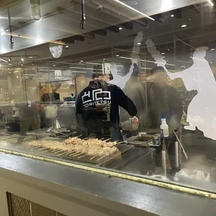 a man preparing food in a restaurant