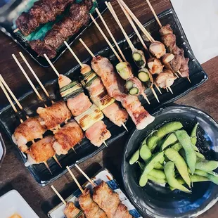 Washugyu (top), pork mochi and cheese, chicken thigh and green onion, chicken thigh, pork asparagus, pork mushroom, edamame