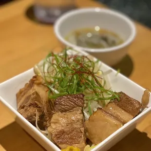 a bowl of ramen and a bowl of soup