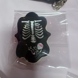 a skeleton cookie in a plastic bag