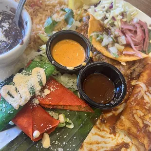 Enchiladas, flauta, rice and beans and delicious taco de birria