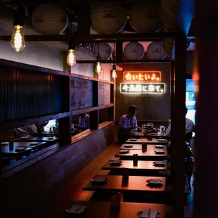 a man sitting at a table in a restaurant