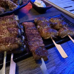 Asparagus and mochi wrapped in pork belly and short rib skewer