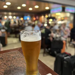 a glass of beer on a table