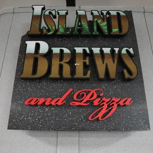 a sign for island brews and pizza