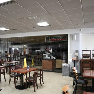 empty tables and chairs in a restaurant