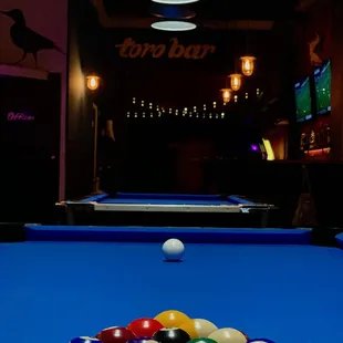 billiards and pool balls on a pool table
