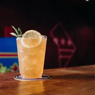 a glass of lemonade on a table