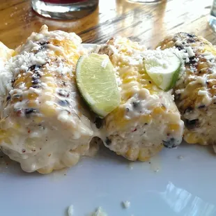 The corn with sexy grill marks and dressed with aioli and cheese