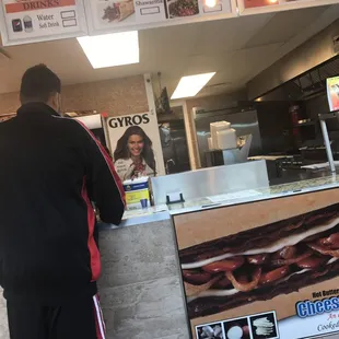 a man standing at a counter