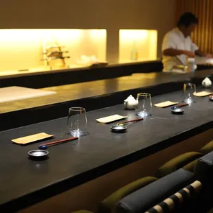 Sip, savor, and soak in the artistry at TORO's sleek bar seating - where every seat is a front-row view to the culinary magic.