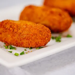 a plate of deep fried chicken nuggies