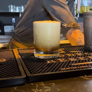 Finalizing the drink.