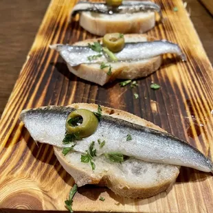 Vinegar soaked anchovies on bread