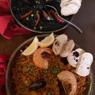 Arroz Negro on top and Toro Paella on the bottom