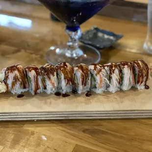 Vegas Roll - avocado, cream cheese, shrimp tempura, on top kanikama eel sauce, spicy Mayo.