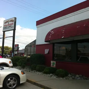 a car parked in front of a restaurant