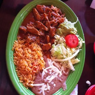 Pork Chili Colorado w/ beans &amp; rice. Spicy. Very good &amp; tender meat. Star of the meal.